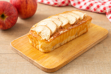 apple loaf crumbled on wood board