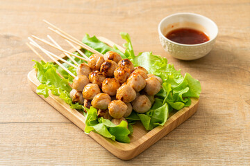 grilled meatballs skewer with spicy sauce