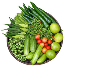 The vegetables set is comprised of variety of organic vegetables and herbs, such as: Winged beans, cucumbers, turkey berry, lemons, tomatoes and chili. Vegetable set in basket.