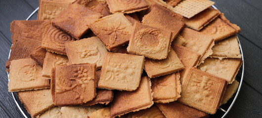 Fototapeta premium lots of delicious cinnamon waffles on a tray