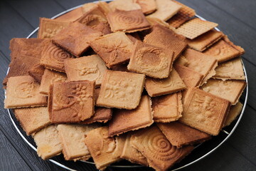 lots of delicious cinnamon waffles on a tray