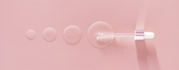 banner pipette drops of serum on pink background
