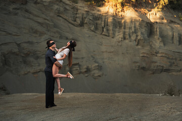 Romantic couple blindfolded with black ribbon dancing. Love blind concept