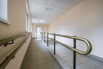 smooth rise and handrails inside the building for people with disabilities