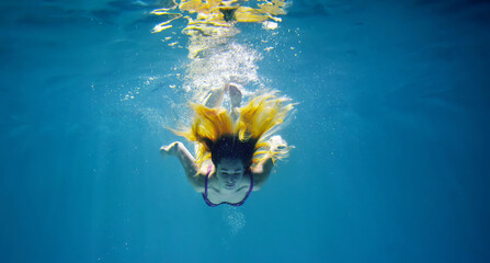 underwater shooting of a girl with loose hair