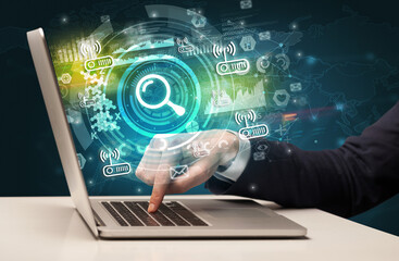 Business hand typing on a modern laptop