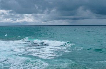 Fototapeta na wymiar view of ocean waves and a fantastic rocky shore