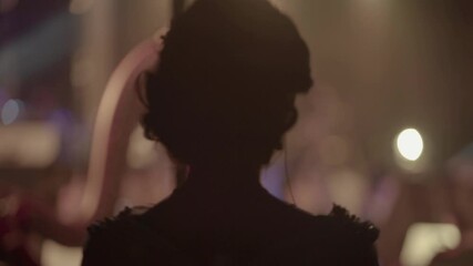 Woman singer waiting to go on stage