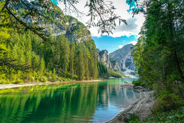 Fototapeta na wymiar Tranquil green waters of Lake Prags in the italian Dolomites