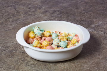 colored popcorn in a children's plate