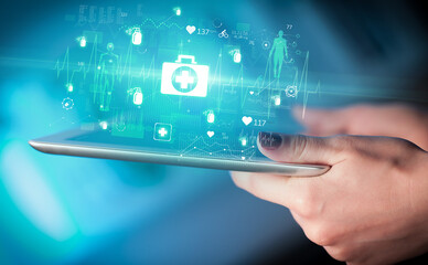 Close-up of a touchscreen with healthcare icons