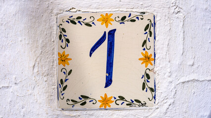ceramic house number table. number: 1. on a white background
