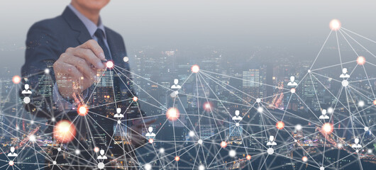 Double exposure of business man pointing people network and digital finance marketing and smart city