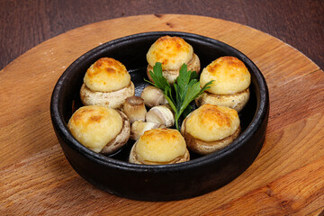 Baked champignon staffed with cheese