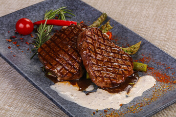 Grilled beef steak served pepper