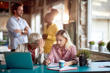 Group of professional coworkers brainstorming together