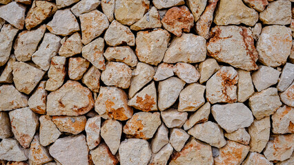 drywall texture. white and red interlocking stones. Menorca, Spain