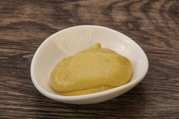 Dijon mustard sauce in the bowl