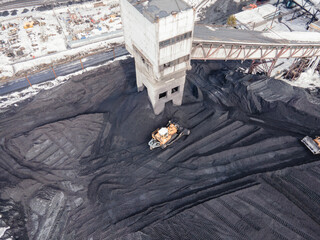 coal mining, top view aerial. Industrial zone. loading coal into trucks. Open pit mine, extractive...