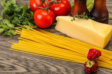 Raw Italian spaghetti heap with cheese