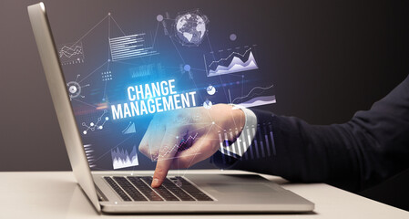 Businessman working on laptop, business concept