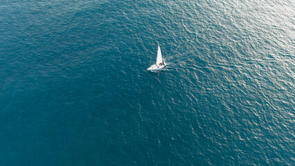 Sail boat in the sea, aerial view, drone shot.