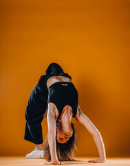 Modern dance artist doing bridge exercise