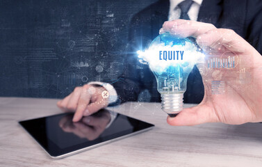 Businessman holding a light bulb, business concept