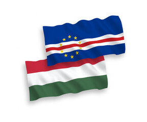National vector fabric wave flags of Republic of Cabo Verde and Hungary isolated on white background. 1 to 2 proportion.