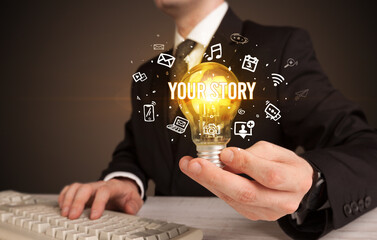 Businessman holding a light bulb, social media concept