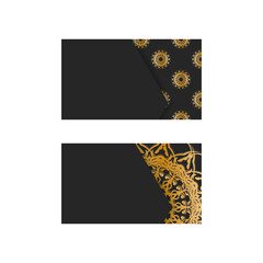 Business card in black color with mandala gold ornament for your brand.