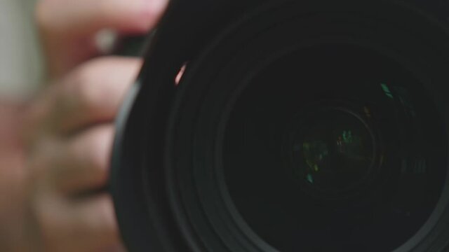 Close Up Panning To Professional Camera Lens

