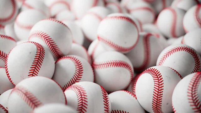 Close-up of a Pile of White Baseballs with Red Stitching