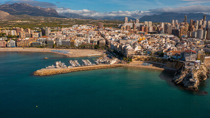 Benidorm,Alicante,Spain.Aerial photo from drone to Benidorm city skyline with beach and mountains in the background.These are the most beautiful views from the drone to the skyscrapers of Benidorm