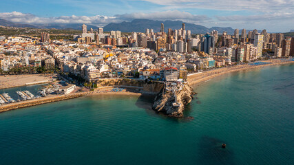 Benidorm,Alicante,Spain.Aerial photo from drone to Benidorm city skyline with beach and mountains...