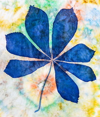 hand painted blue chestnut leaf on silk scarf with abstract pattern in Tie-dye batik technique on background