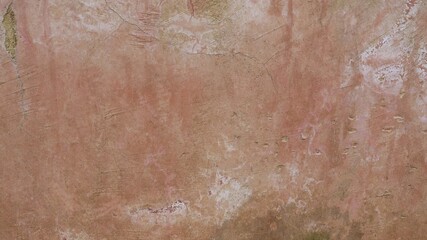 The old cement wall was weathered, the surface was scratched, the surface was scratched and damaged. For a mysterious retro-conservative background.