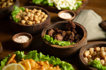 hot meat snacks for beer served on wooden dish