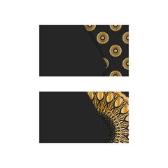 Business card in black with abstract gold ornaments for your brand.