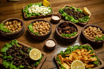 hot meat snacks for beer served on wooden dish