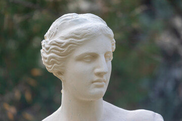 Antique sculptural composition with a woman and a column