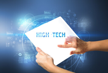 Hand holdig futuristic tablet , technology concept
