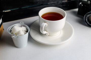 A cup of tea on the table. View from above. A cup on a saucer.