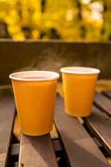 autumn mood. autumn leaves and a glass of coffee. yellow autumn leaves background