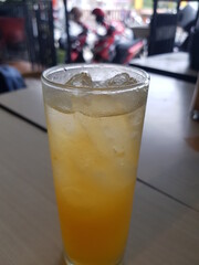 Bubbles in a glass of squeezed orange juice