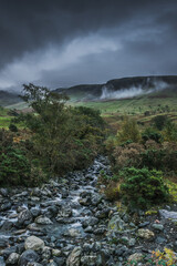 Mountain's river in cloudy valley near Scafell Pike, Lake District, UK