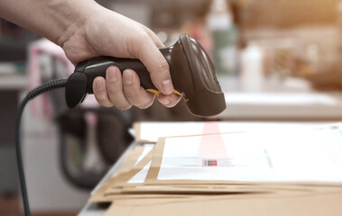 Barcode scanner in documents. Hand scan with barcode reader