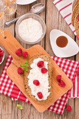 Rye bread with cottage cheese and raspberries.
