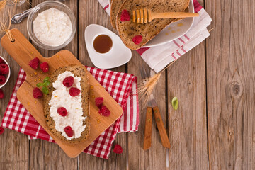 Rye bread with cottage cheese and raspberries.