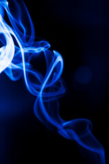 Motion blue smoke on black background.